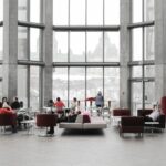 Spacious lounge with modern decor and large windows showcasing a snowy Ottawa view.